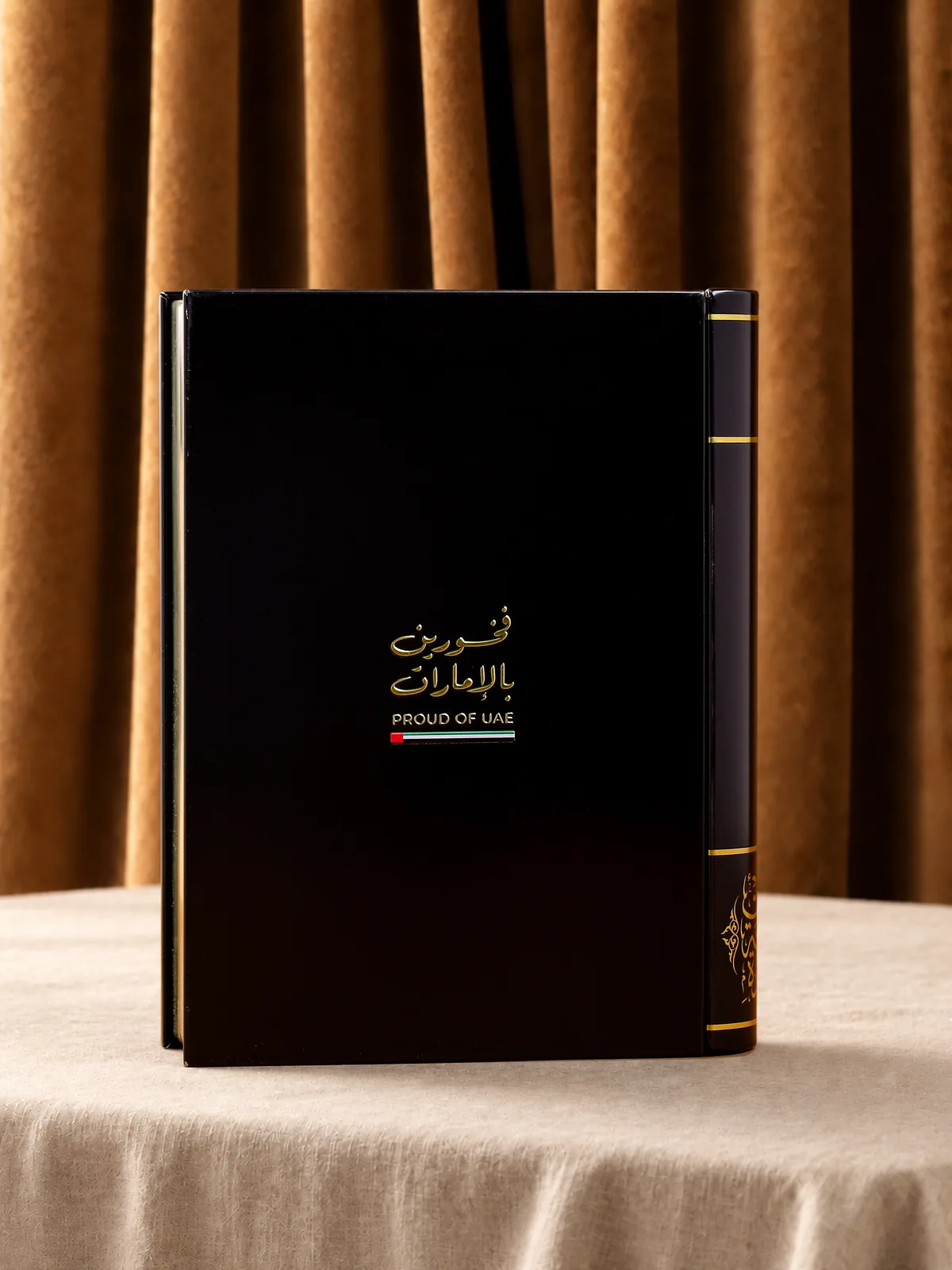 The "Proud of UAE" metal book, closed