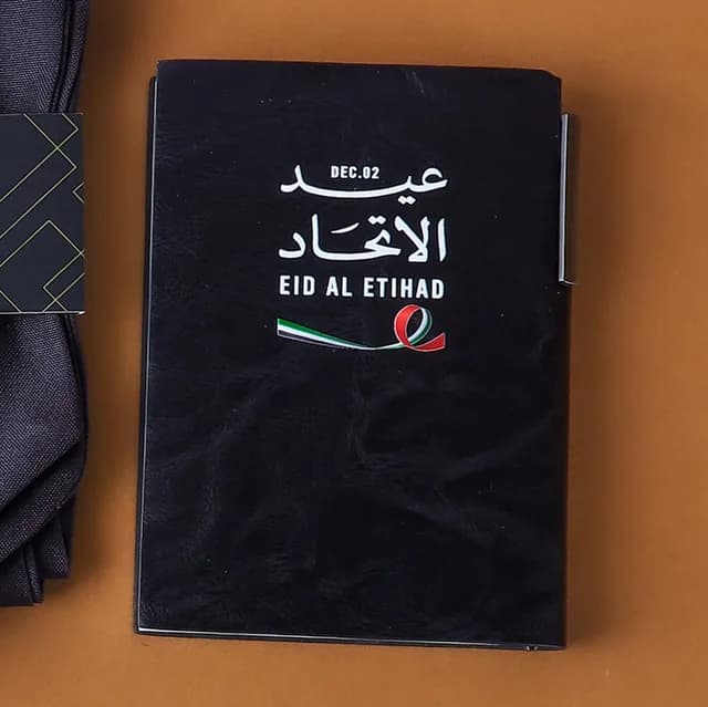 Eid Al Etihad notebook with a pen