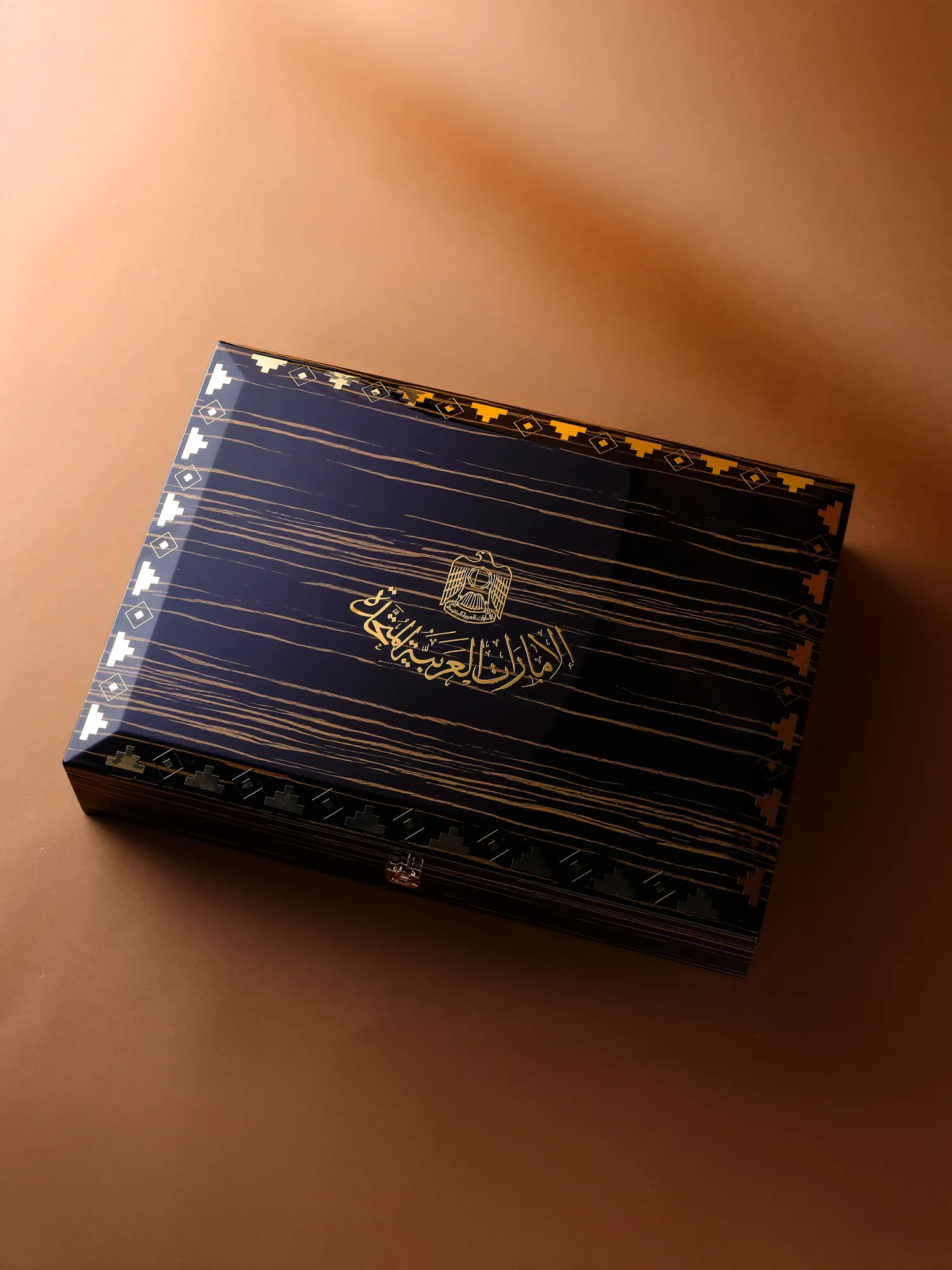 The VIP wooden box closed, with the national emblem on its lid